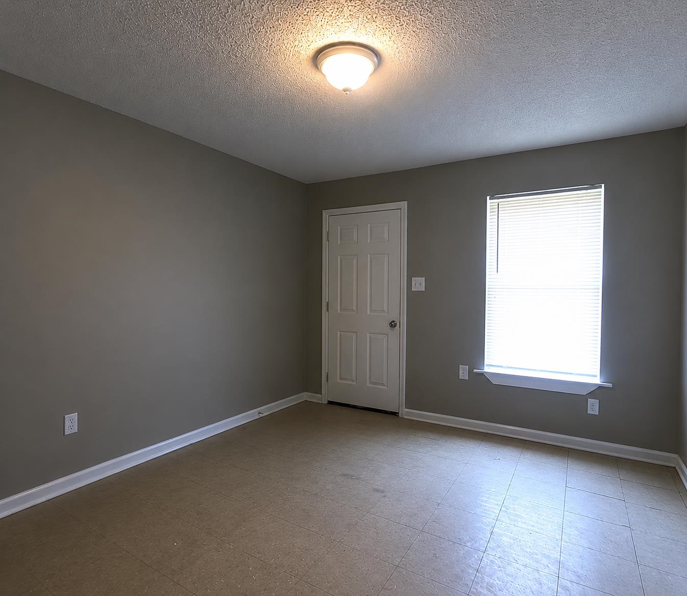 1672 Clancy Street Memphis, TN 38106 - Photo 7 of 7 Neutral-toned walls complement the light-colored flooring