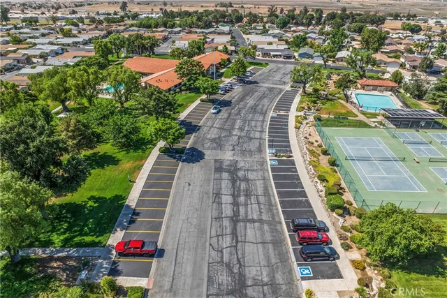 an aerial view of residential houses with yard