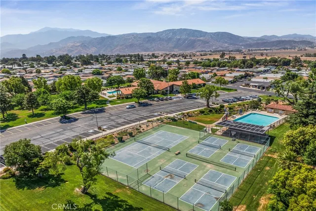 a view of a lush green hillside and a houses