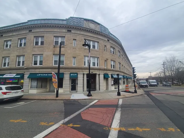 a front view of a building with street view