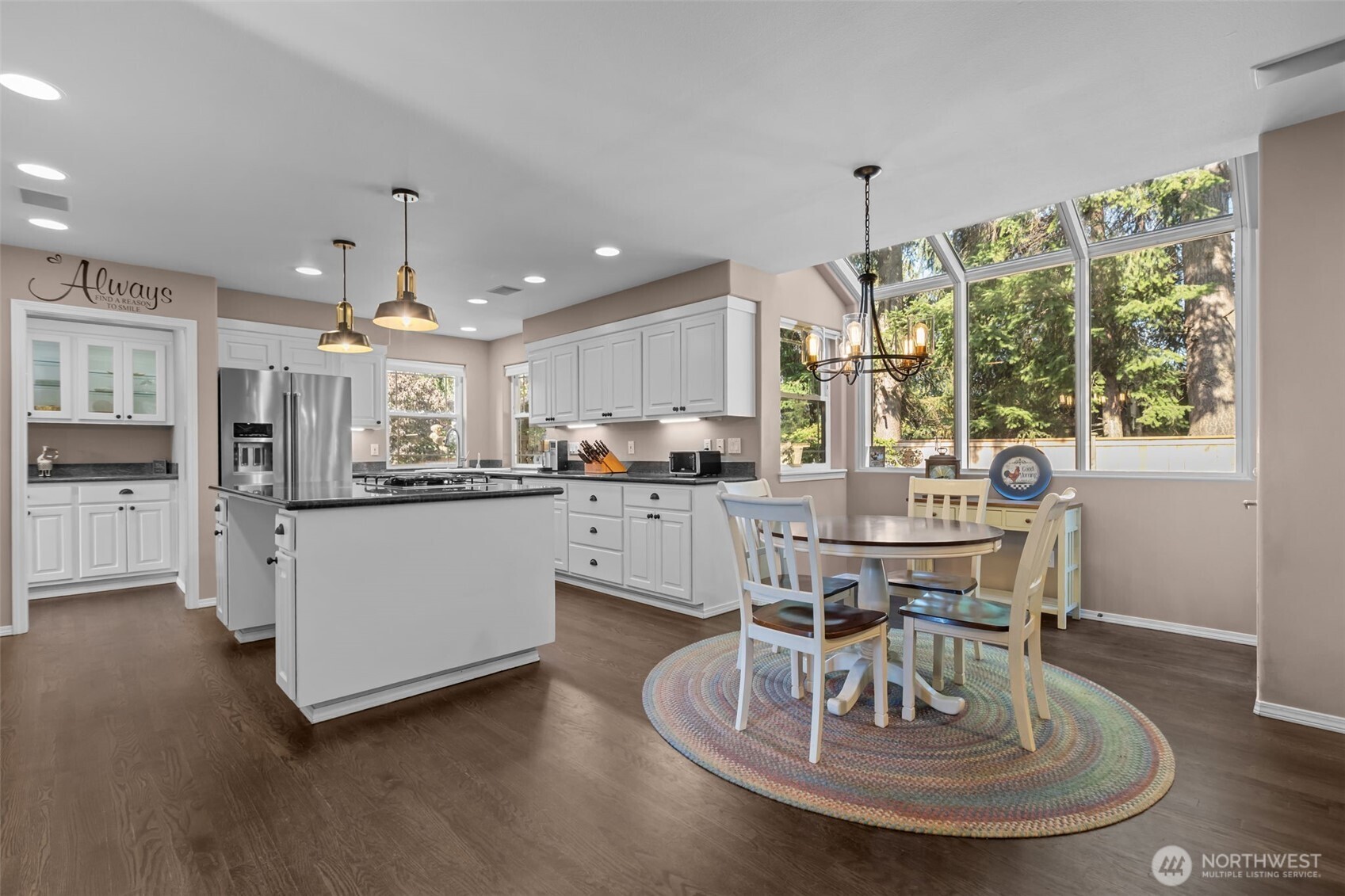 102 Stone Ridge Drive Snohomish, WA 98290 - Photo 13 of 38 a living room with kitchen island furniture and a chandelier