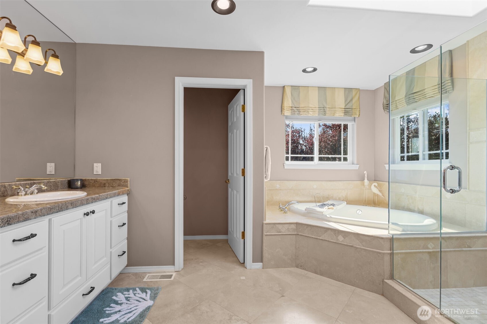 102 Stone Ridge Drive Snohomish, WA 98290 - Photo 23 of 38 a bathroom with a granite countertop sink mirror and bathtub