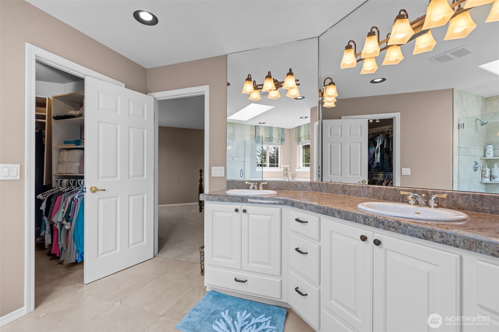 102 Stone Ridge Drive Snohomish, WA 98290 - Photo 24 of 38 a spacious en suite bathroom with a granite countertop double vanity sink and a mirror