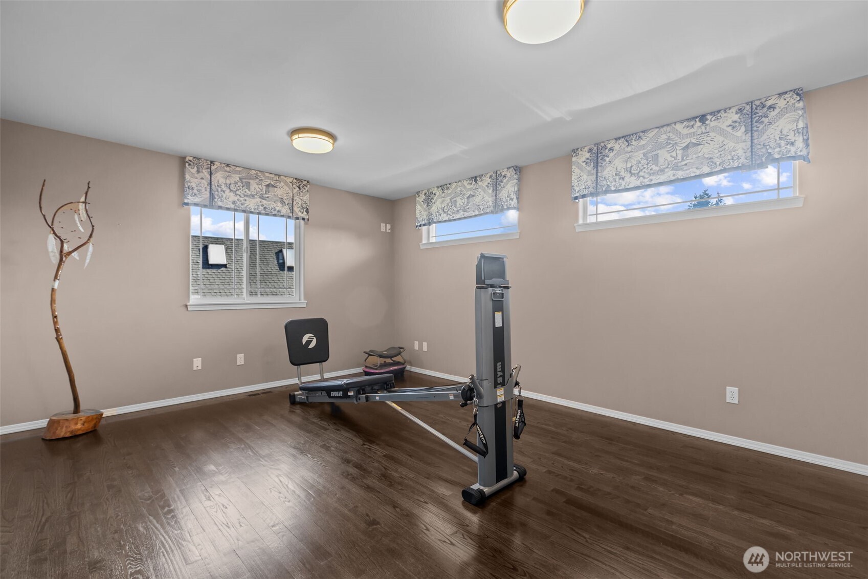 102 Stone Ridge Drive Snohomish, WA 98290 - Photo 25 of 38 a room with gym equipment and wooden floor