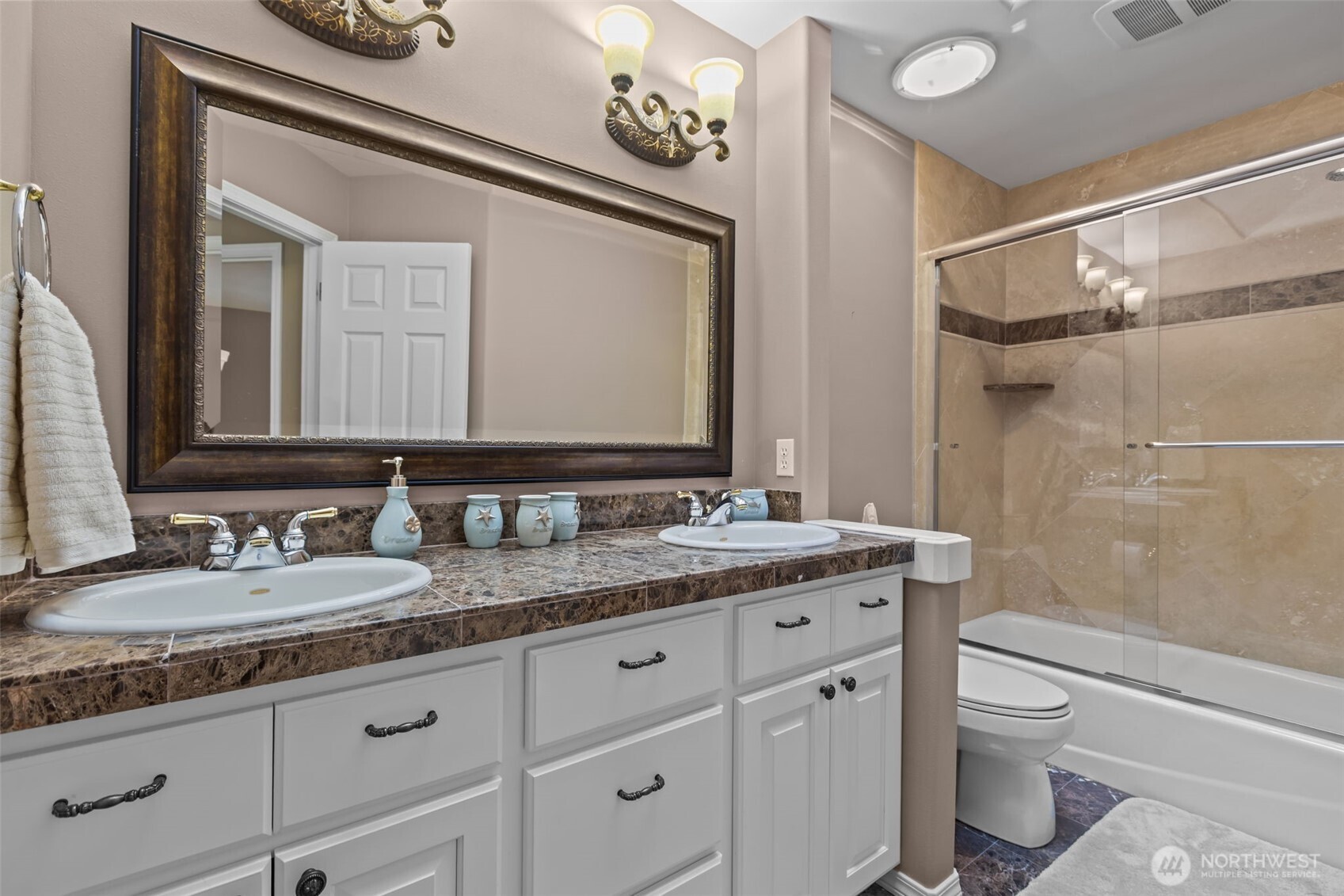 102 Stone Ridge Drive Snohomish, WA 98290 - Photo 28 of 38 a bathroom with a granite countertop sink a toilet and a mirror