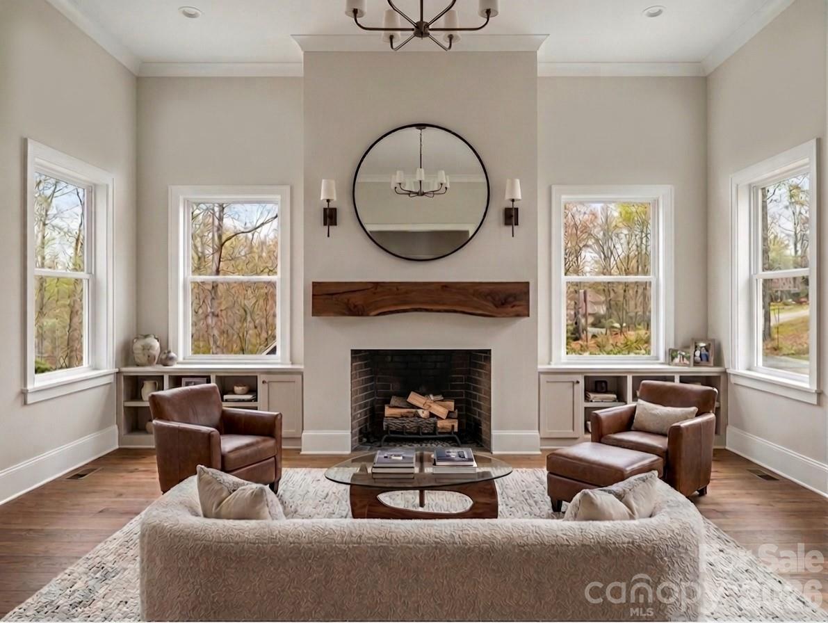 285 Woodridge Drive Rutherfordton, NC 28139 - Photo 3 of 42 a living room with furniture a window and a fireplace