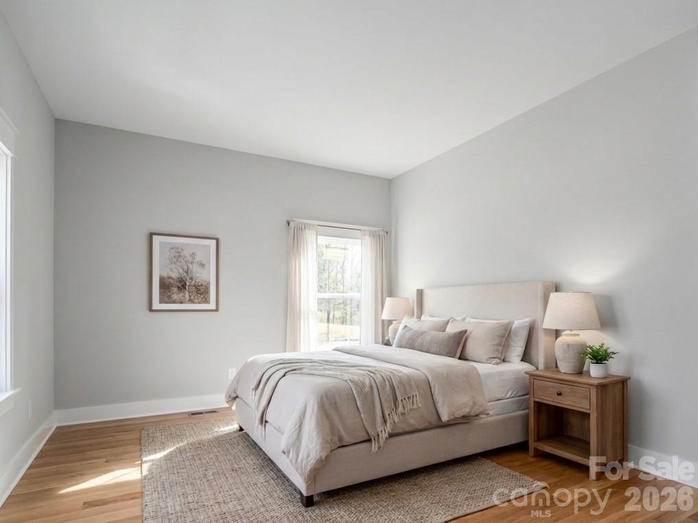285 Woodridge Drive Rutherfordton, NC 28139 - Photo 5 of 42 a bedroom with bed and a night stand