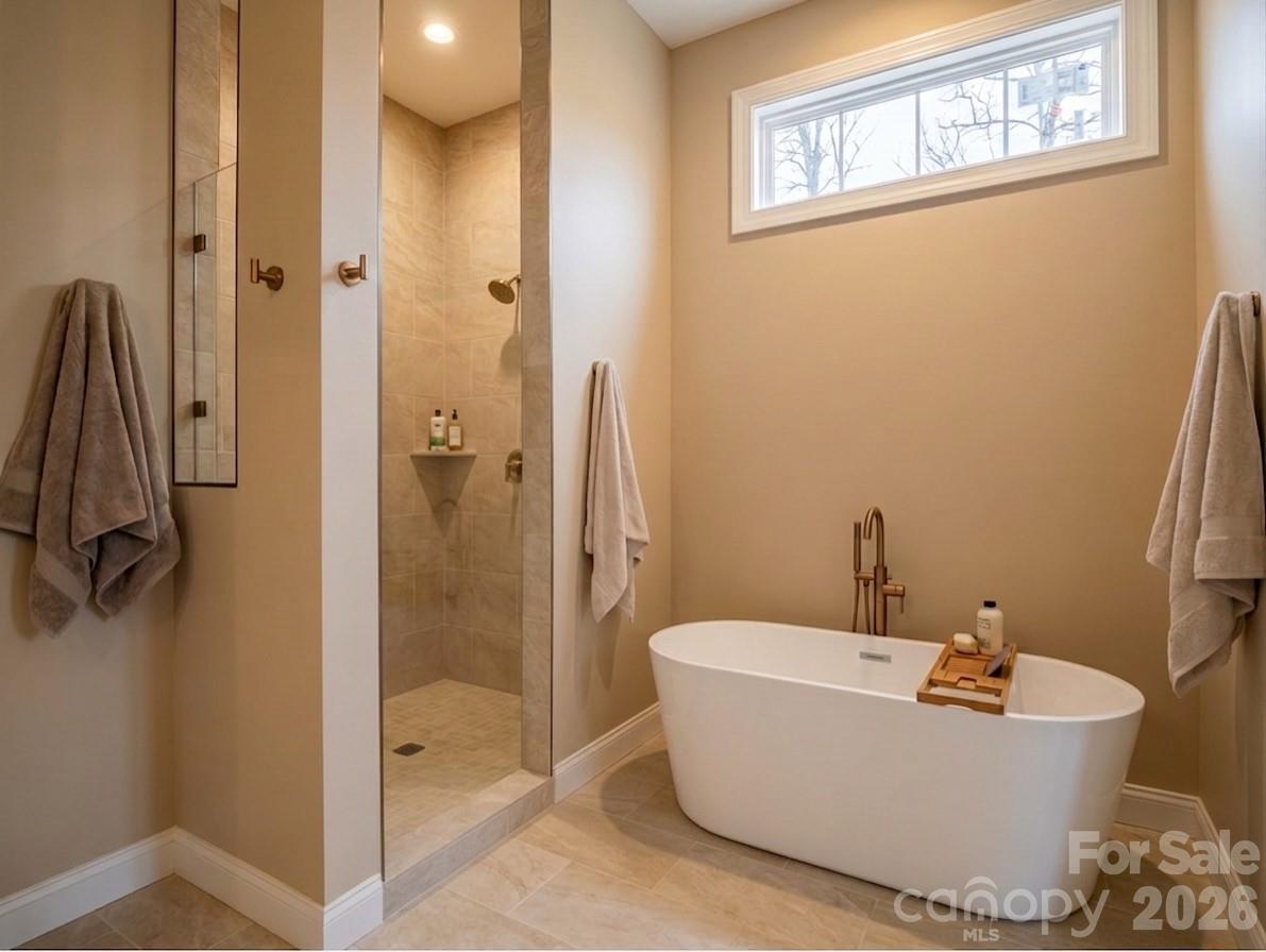 285 Woodridge Drive Rutherfordton, NC 28139 - Photo 8 of 42 a bathroom with a bathtub and shower