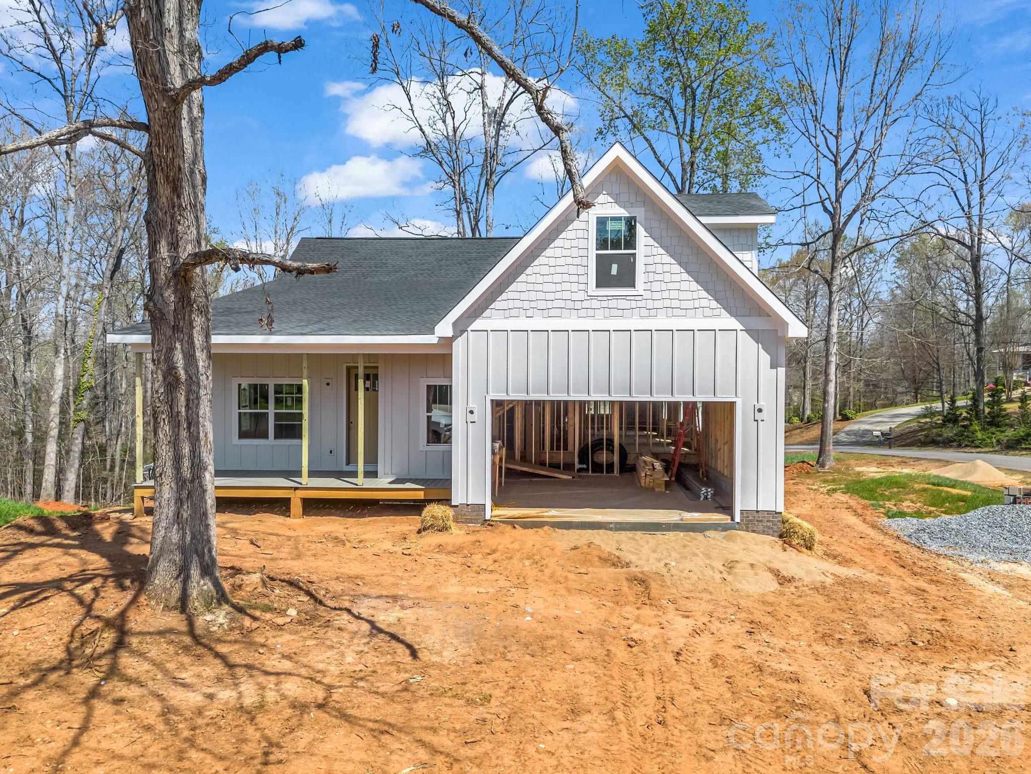 285 Woodridge Drive Rutherfordton, NC 28139 - Photo 9 of 42 a view of a house with a patio and a yard
