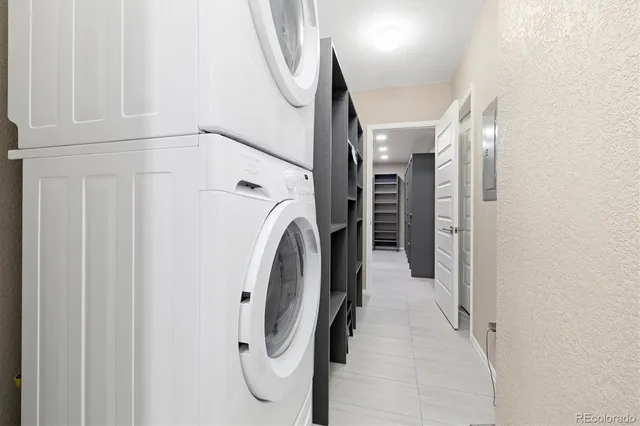 a view of a hallway with washer and dryer