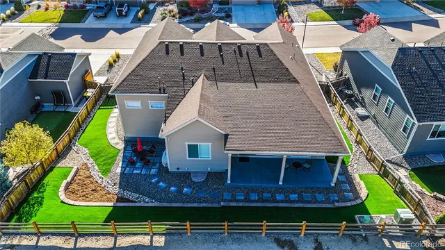 an aerial view of a house with garden space ocean view