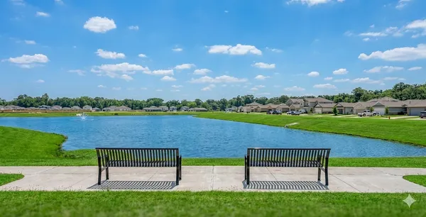 a view of lake with outdoor seating and yard