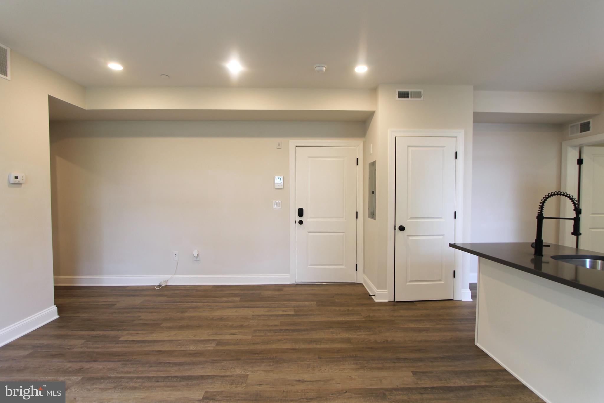 492 Roxborough Avenue, Unit 403 Philadelphia, PA 19128 - Photo 10 of 28 a view of a room with wooden floor