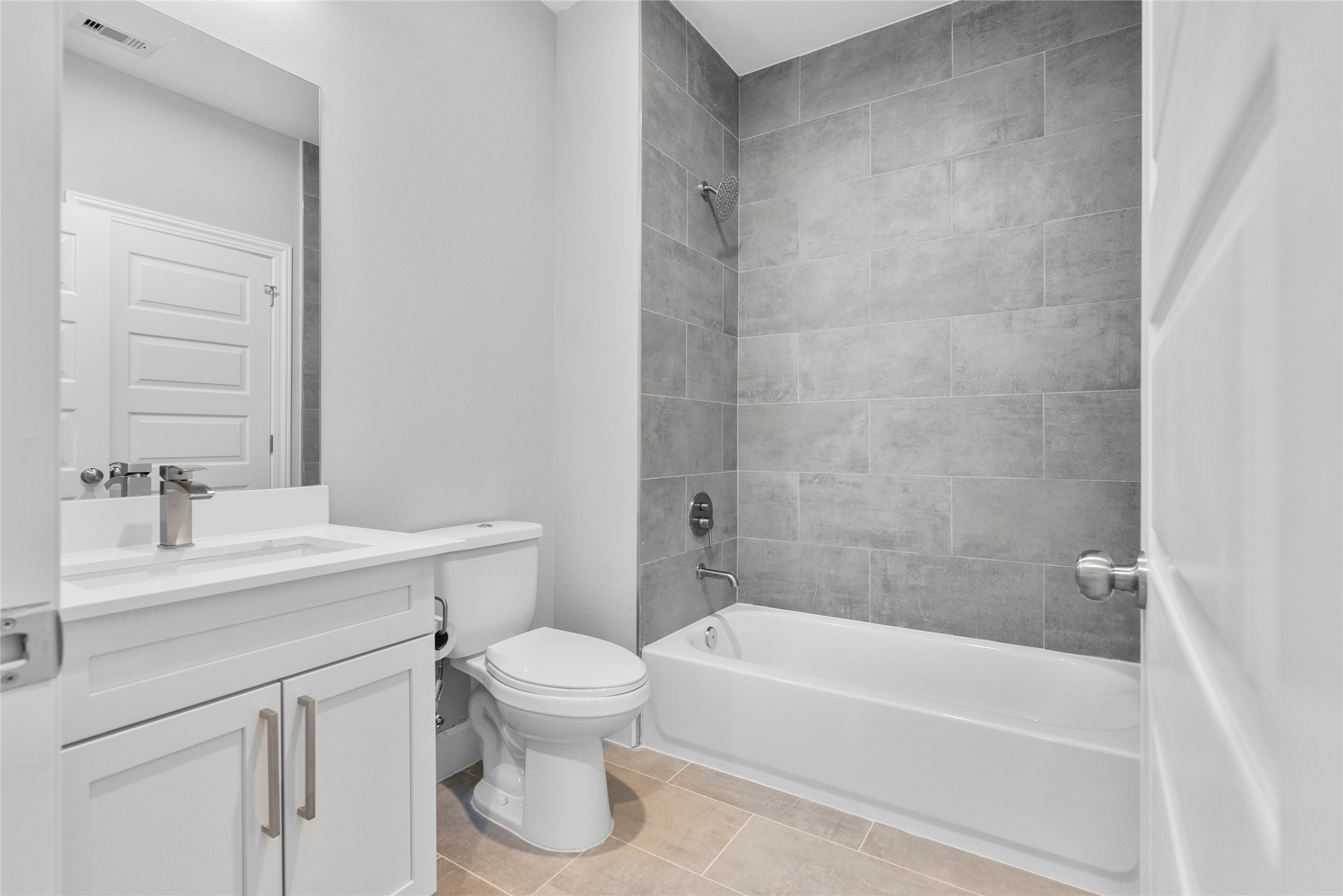 1122 West 16th Street, Unit B Houston, TX 77008 - Photo 6 of 31 a bathroom with a sink a toilet and shower