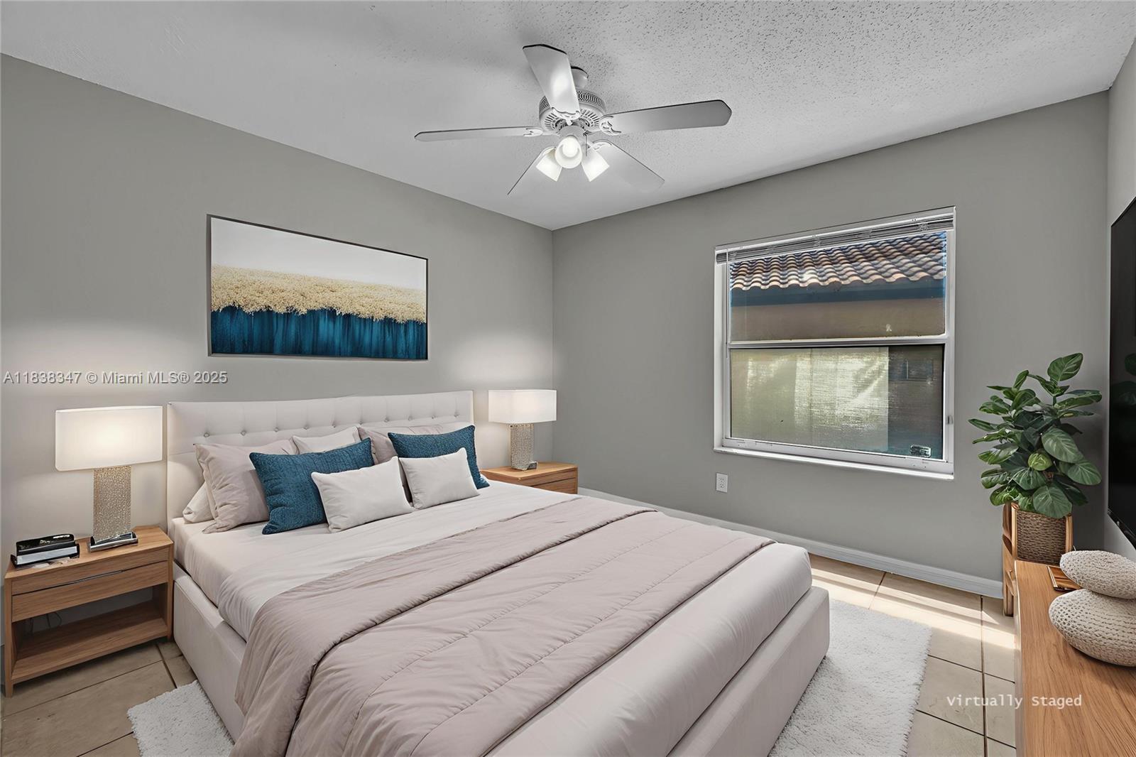 18232 Southwest 5th Street Pembroke Pines, FL 33029 - Photo 16 of 53 a bedroom with a bed and a painting on the wall