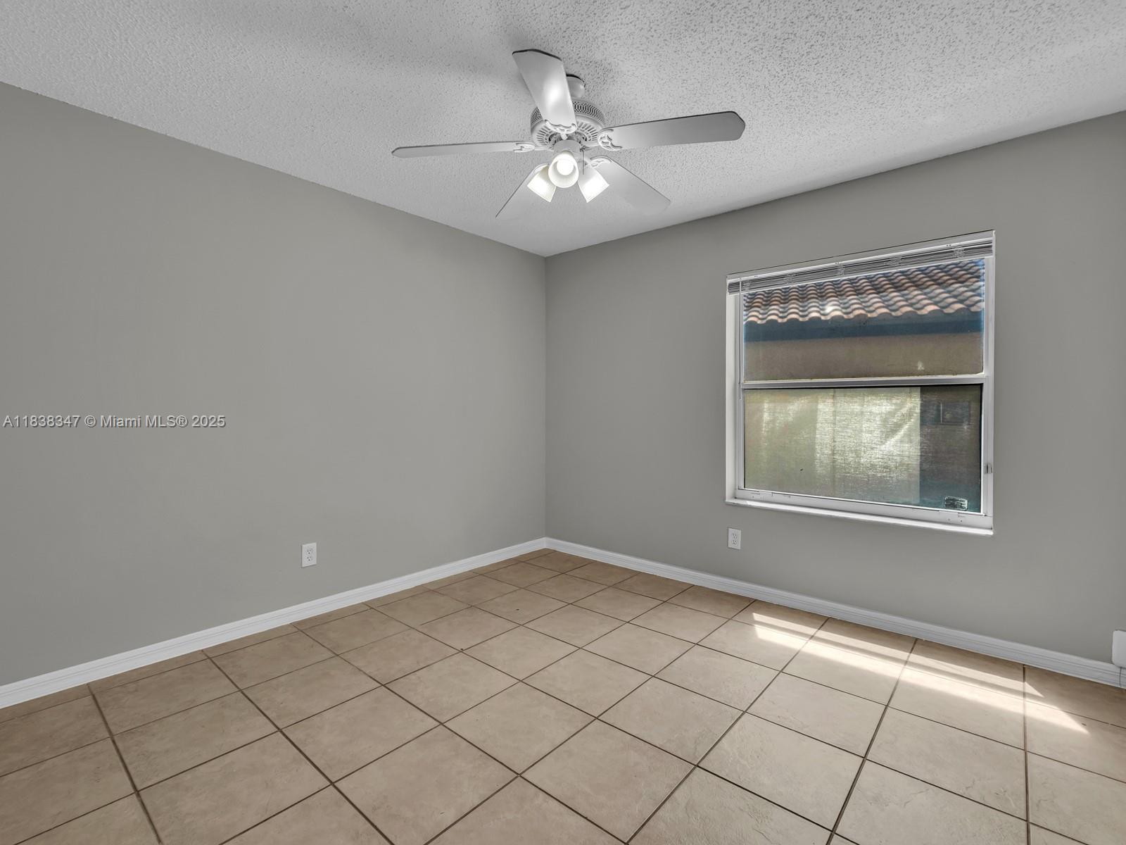 18232 Southwest 5th Street Pembroke Pines, FL 33029 - Photo 18 of 53 a view of an empty room with a window