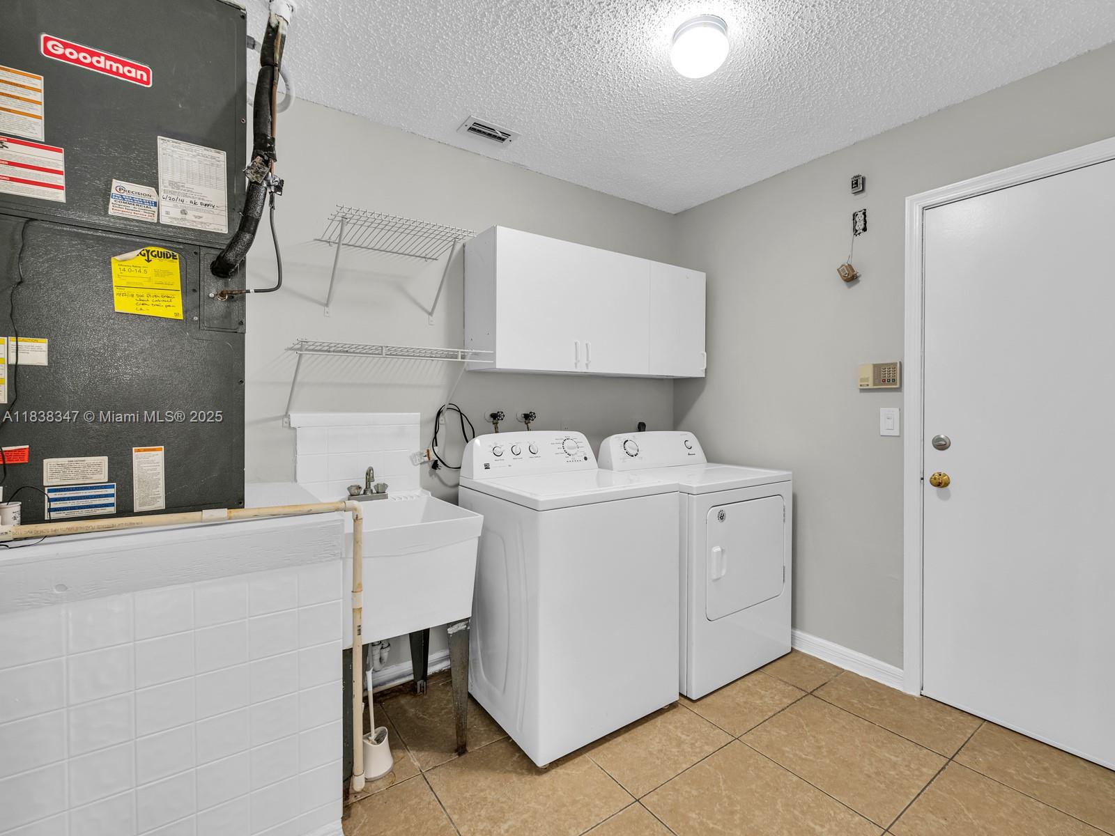 18232 Southwest 5th Street Pembroke Pines, FL 33029 - Photo 19 of 53 a utility room with dryer and washer