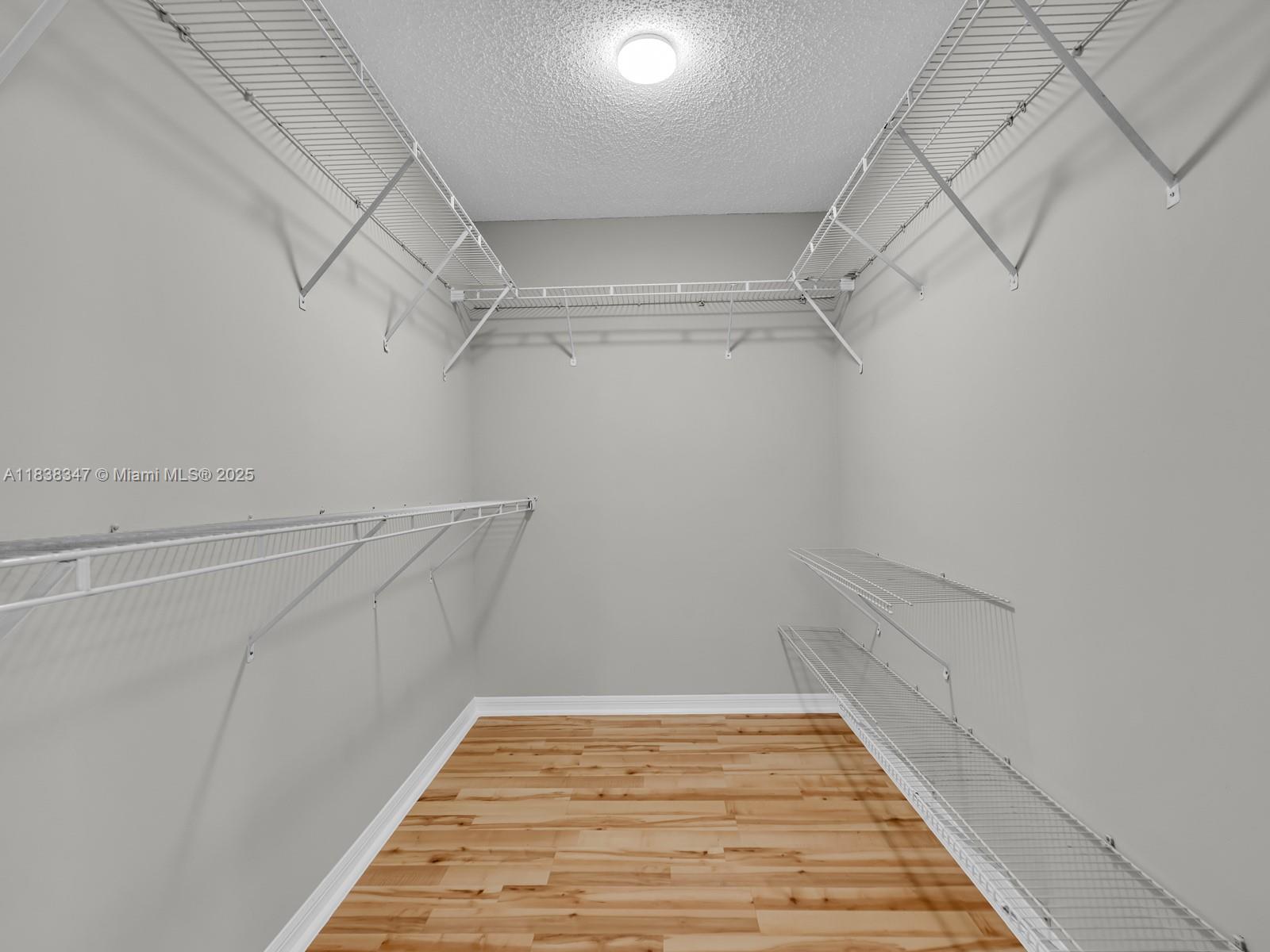 18232 Southwest 5th Street Pembroke Pines, FL 33029 - Photo 25 of 53 a view of a room with racks on the wall