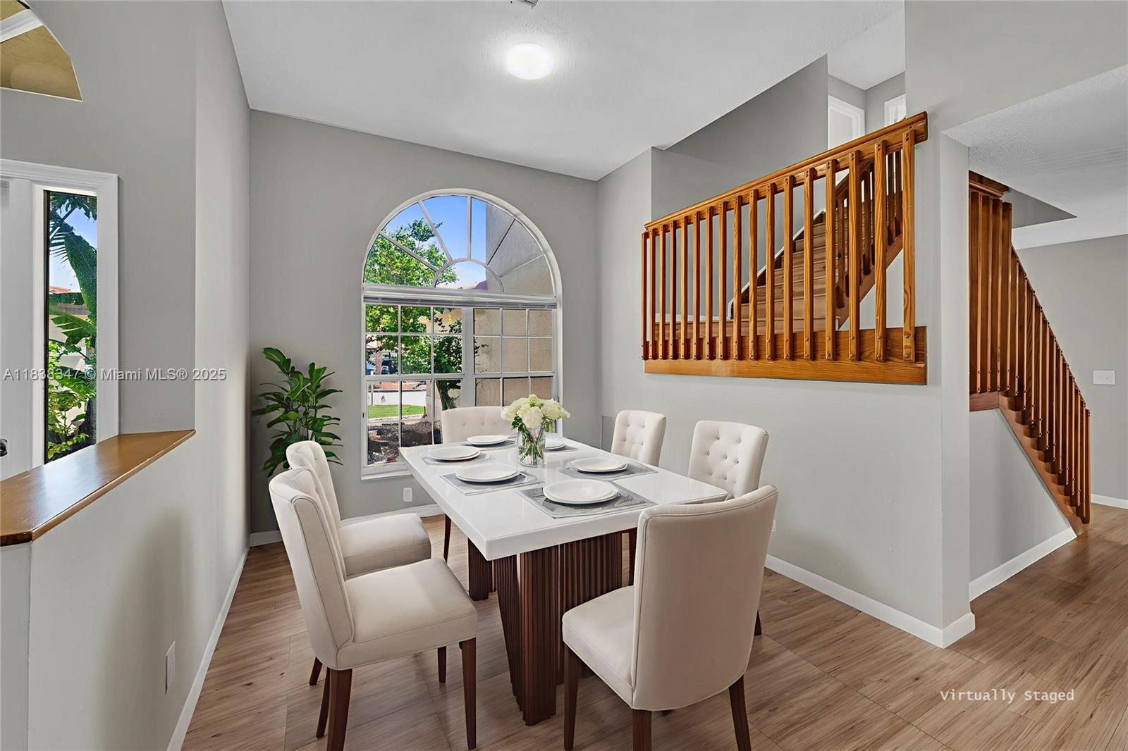 18232 Southwest 5th Street Pembroke Pines, FL 33029 - Photo 3 of 53 a view of a dining room with furniture window and wooden floor