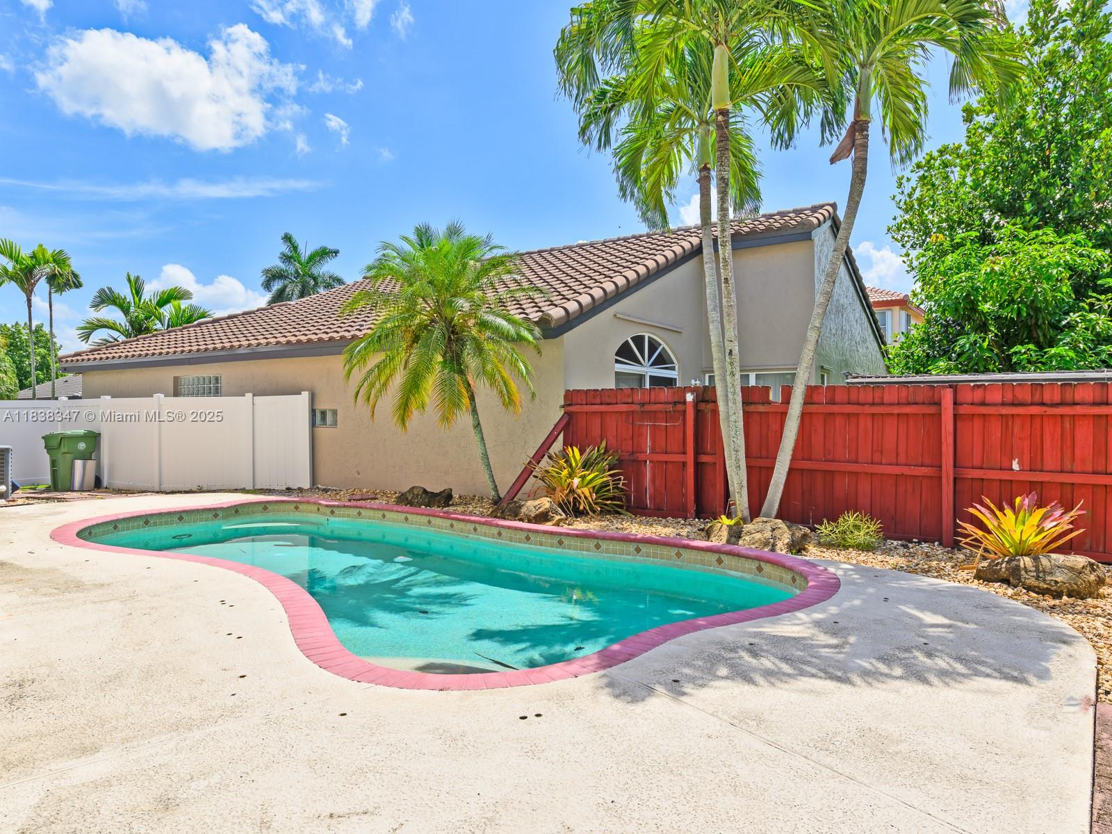 18232 Southwest 5th Street Pembroke Pines, FL 33029 - Photo 33 of 53 a view of a backyard with a garden