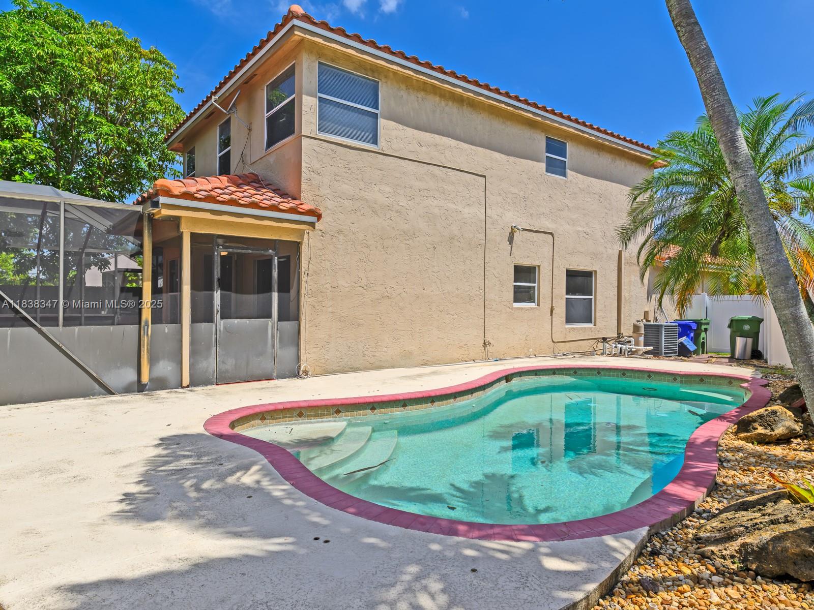 18232 Southwest 5th Street Pembroke Pines, FL 33029 - Photo 35 of 53 a view of outdoor space yard and swimming pool