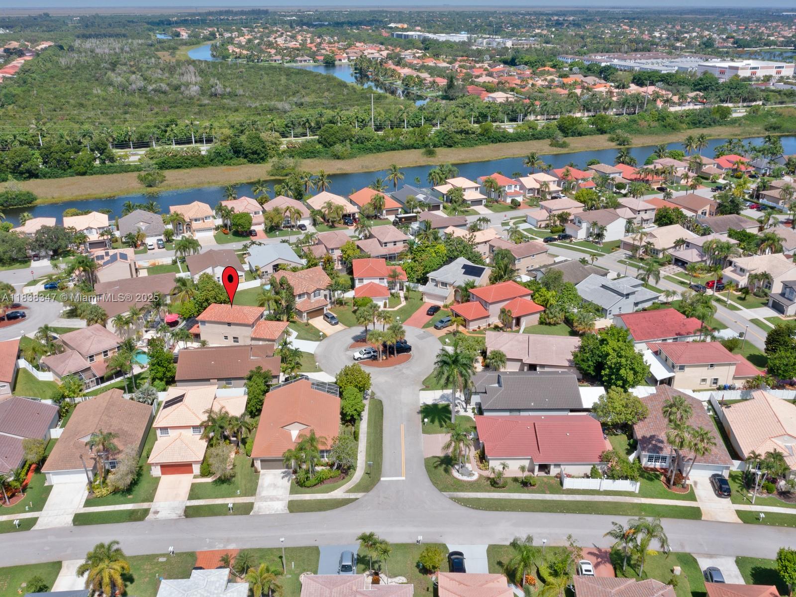 18232 Southwest 5th Street Pembroke Pines, FL 33029 - Photo 43 of 53 an aerial view of a city with lots of residential buildings ocean and mountain view in back