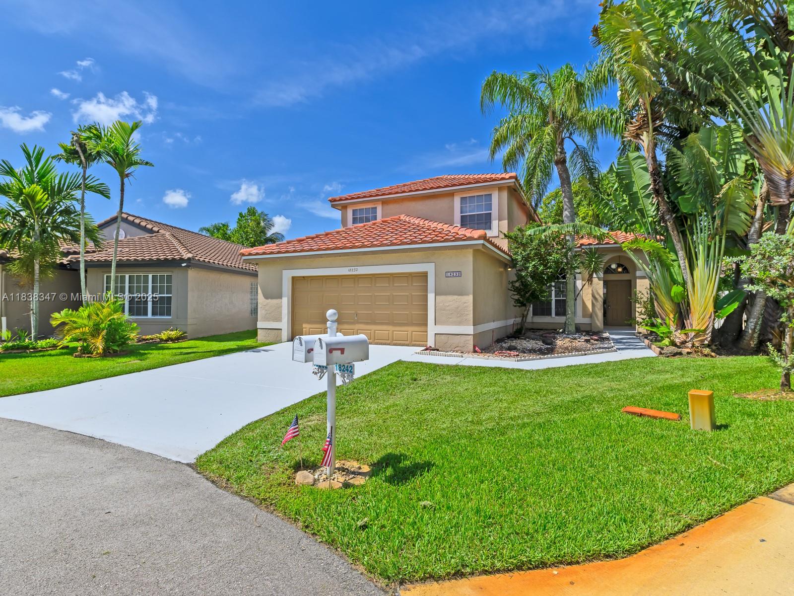 18232 Southwest 5th Street Pembroke Pines, FL 33029 - Photo 49 of 53 a front view of house with yard and outdoor seating