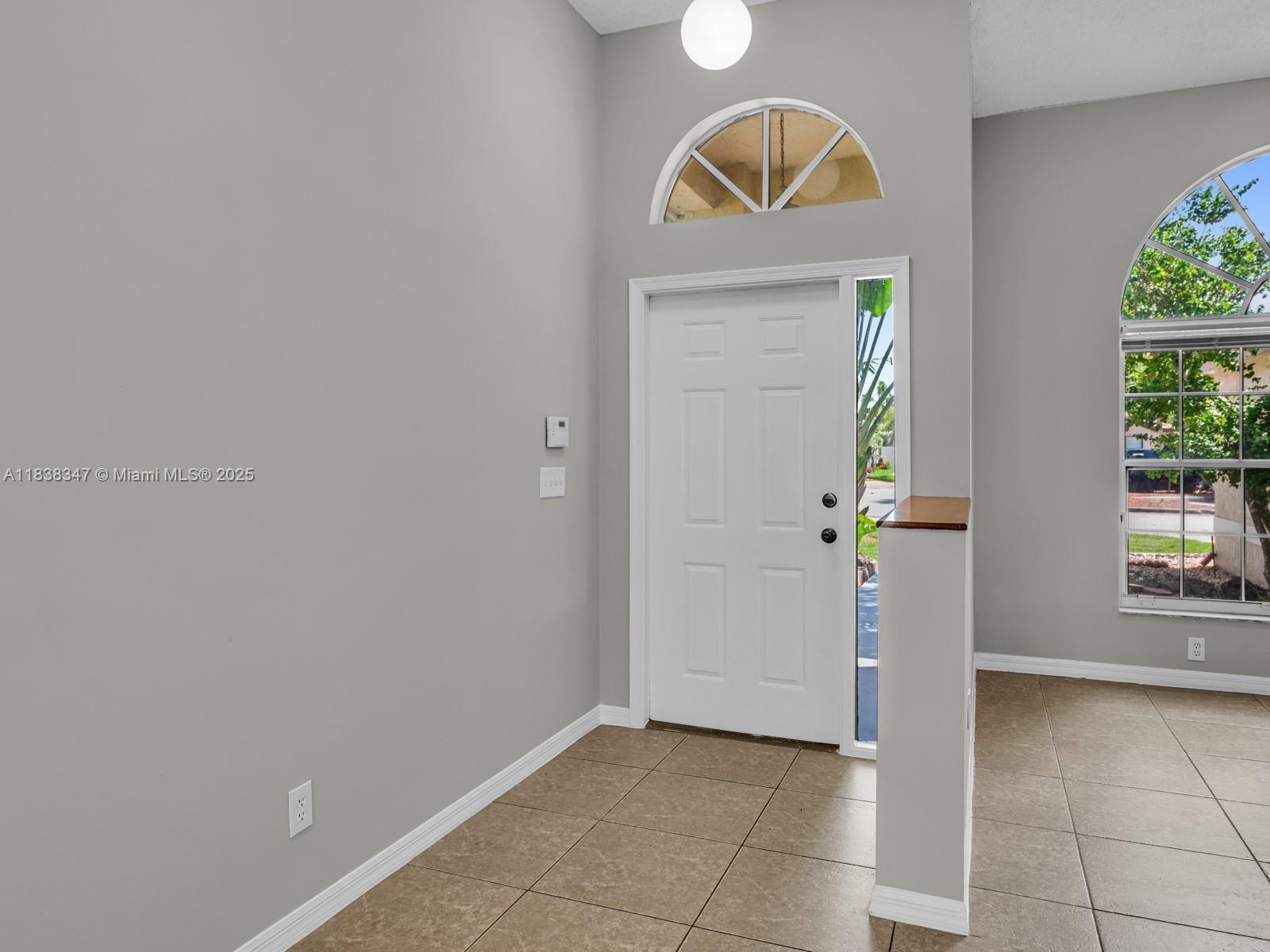18232 Southwest 5th Street Pembroke Pines, FL 33029 - Photo 5 of 53 a view of room with window and wooden floor