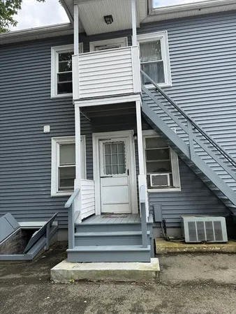 a front view of a house with a stairs
