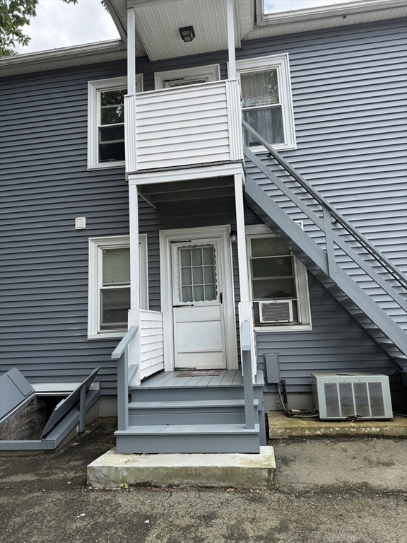 27 Mission Street Gardner, MA 01440 - Photo 2 of 11 a front view of a house with a stairs