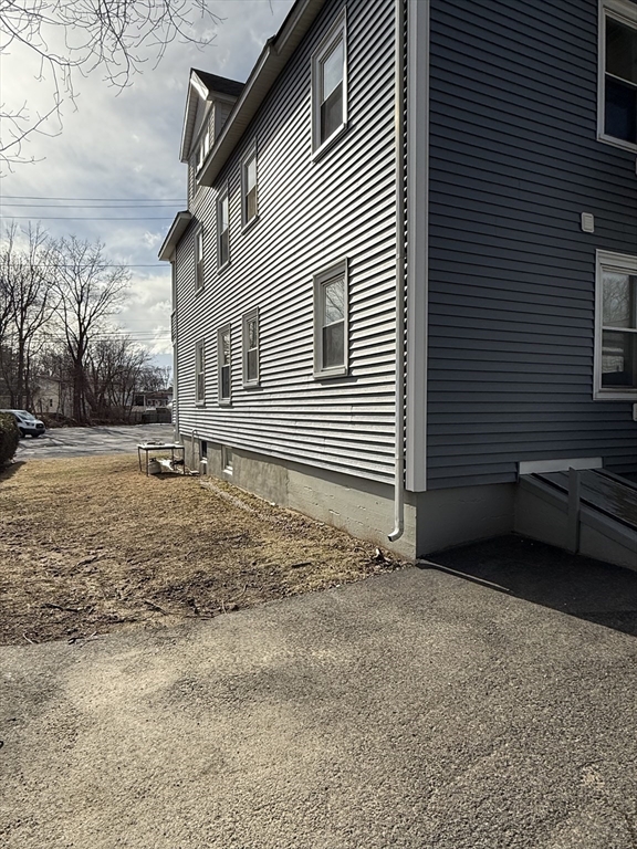 27 Mission Street Gardner, MA 01440 - Photo 5 of 11 a view of a house with a yard and garage