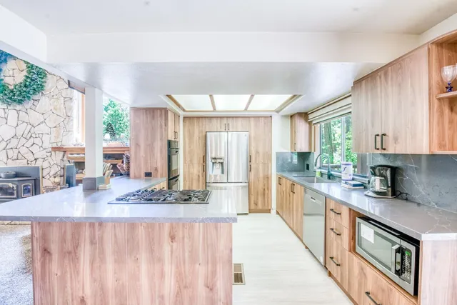 a bedroom with a bed and a baby crib