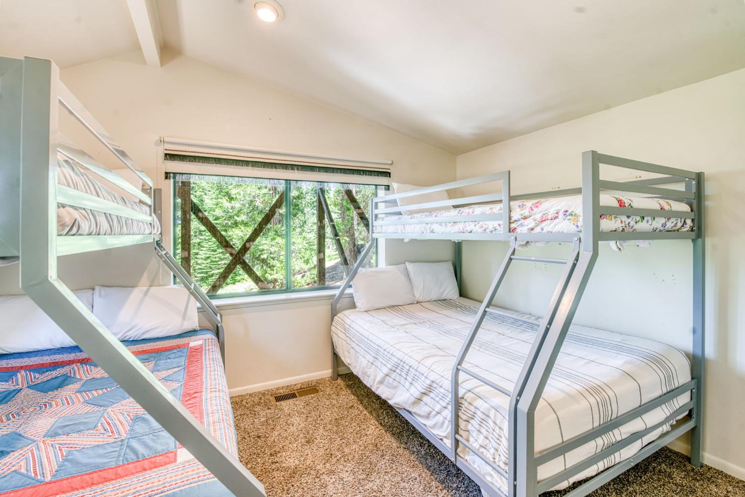 39145 Checkerbloom Lane Shaver Lake, CA 93664 - Photo 21 of 58 a bedroom with a bed and wooden floor