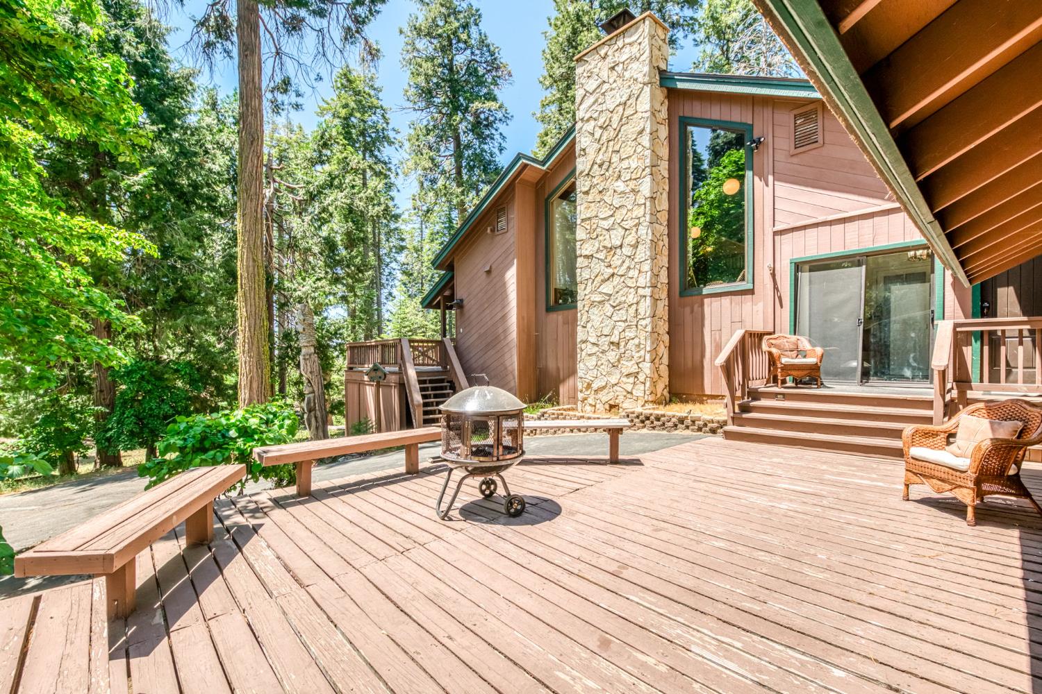 39145 Checkerbloom Lane Shaver Lake, CA 93664 - Photo 3 of 58 a view of sitting area with chairs on wooden deck