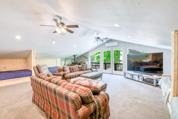a view of a dining room with furniture and a large window