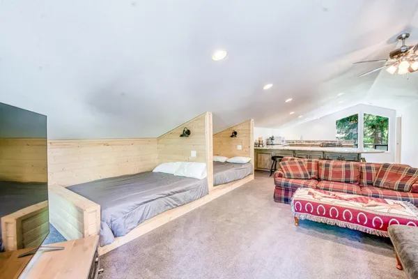 a kitchen with stainless steel appliances granite countertop a stove and a white cabinets