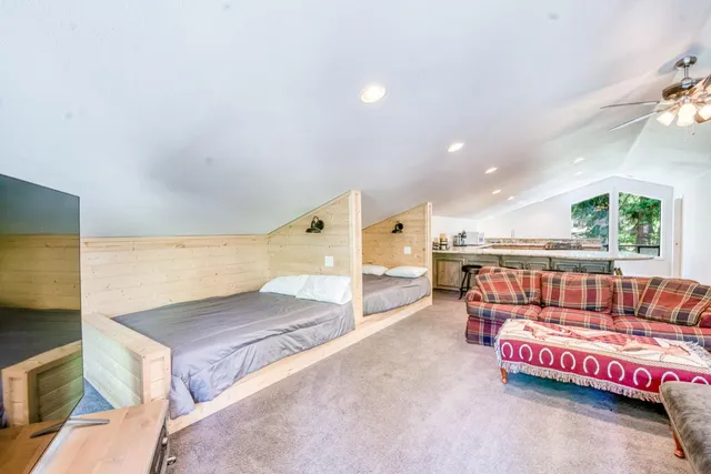 a kitchen with stainless steel appliances granite countertop a stove and a white cabinets