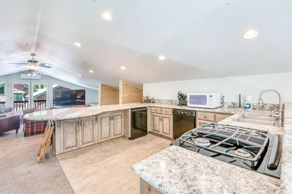 a room with furniture and a ceiling fan