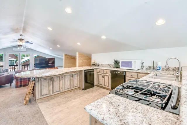 a room with furniture and a ceiling fan