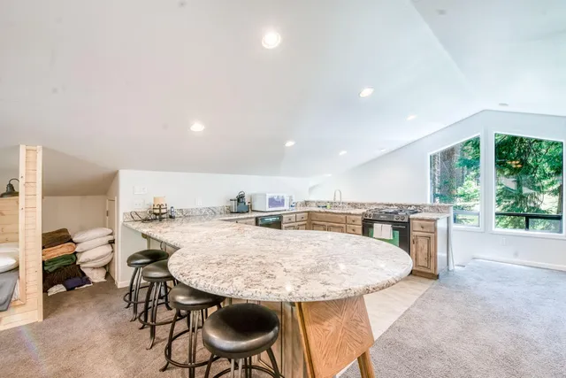 a living room with furniture and white walls