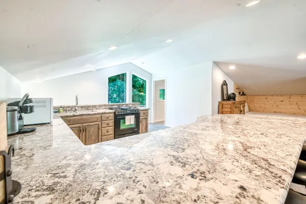 a view of a tree in front of a house