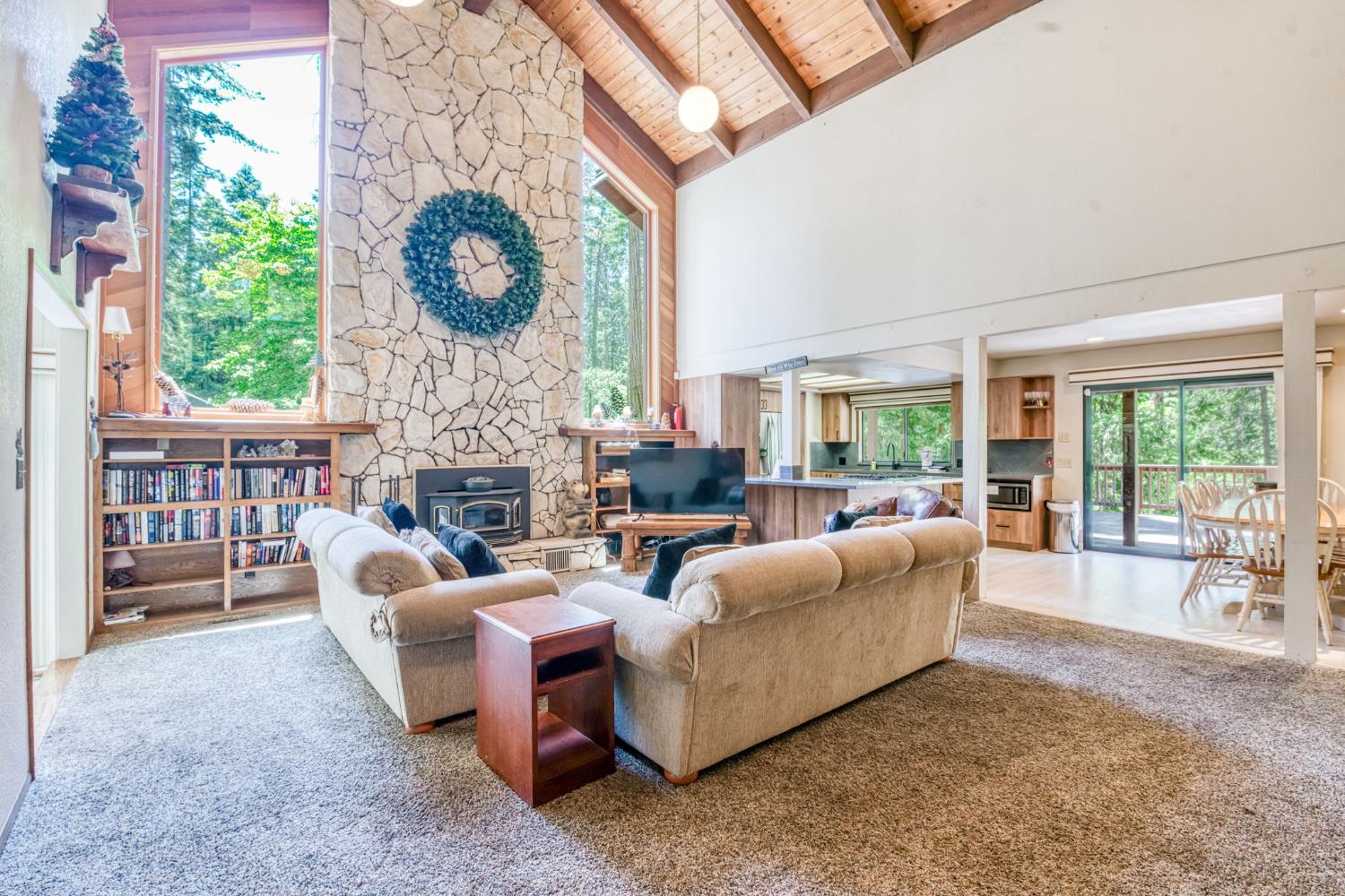 39145 Checkerbloom Lane Shaver Lake, CA 93664 - Photo 4 of 58 a living room with fireplace furniture and a large window