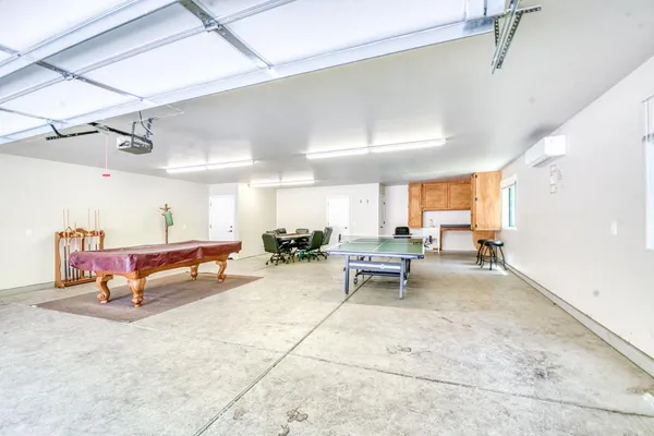 a view of a roof deck with chair and wooden floor