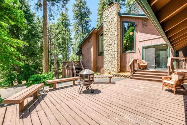 an aerial view of a house with swimming pool and sitting space