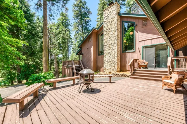 an aerial view of a house with swimming pool and sitting space