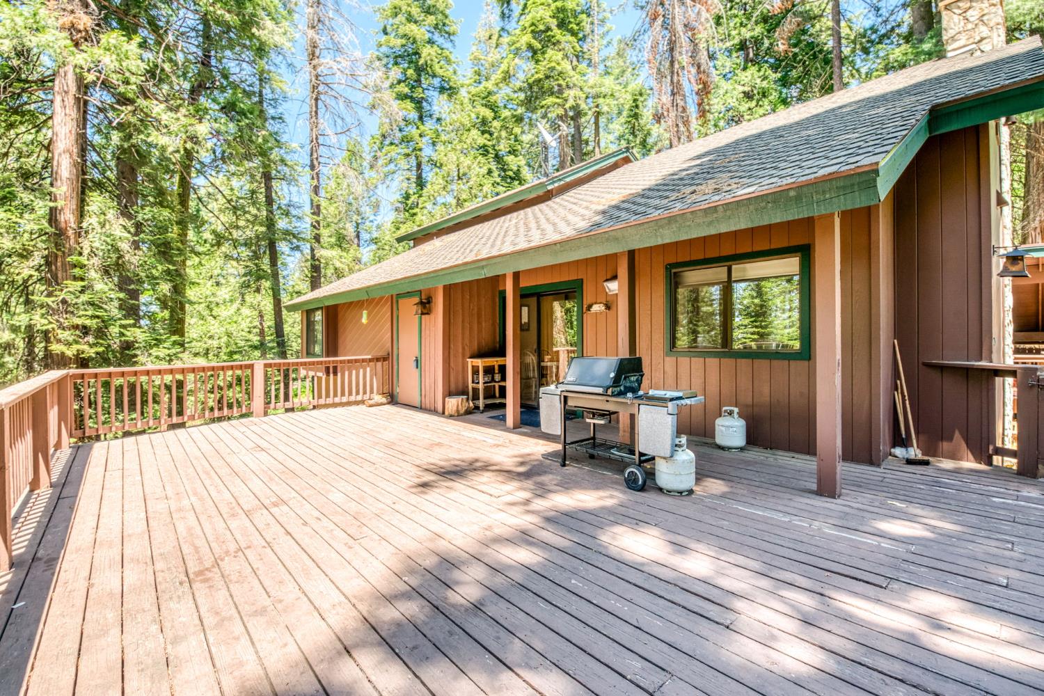 39145 Checkerbloom Lane Shaver Lake, CA 93664 - Photo 47 of 58 a view of a roof deck with chair and wooden floor