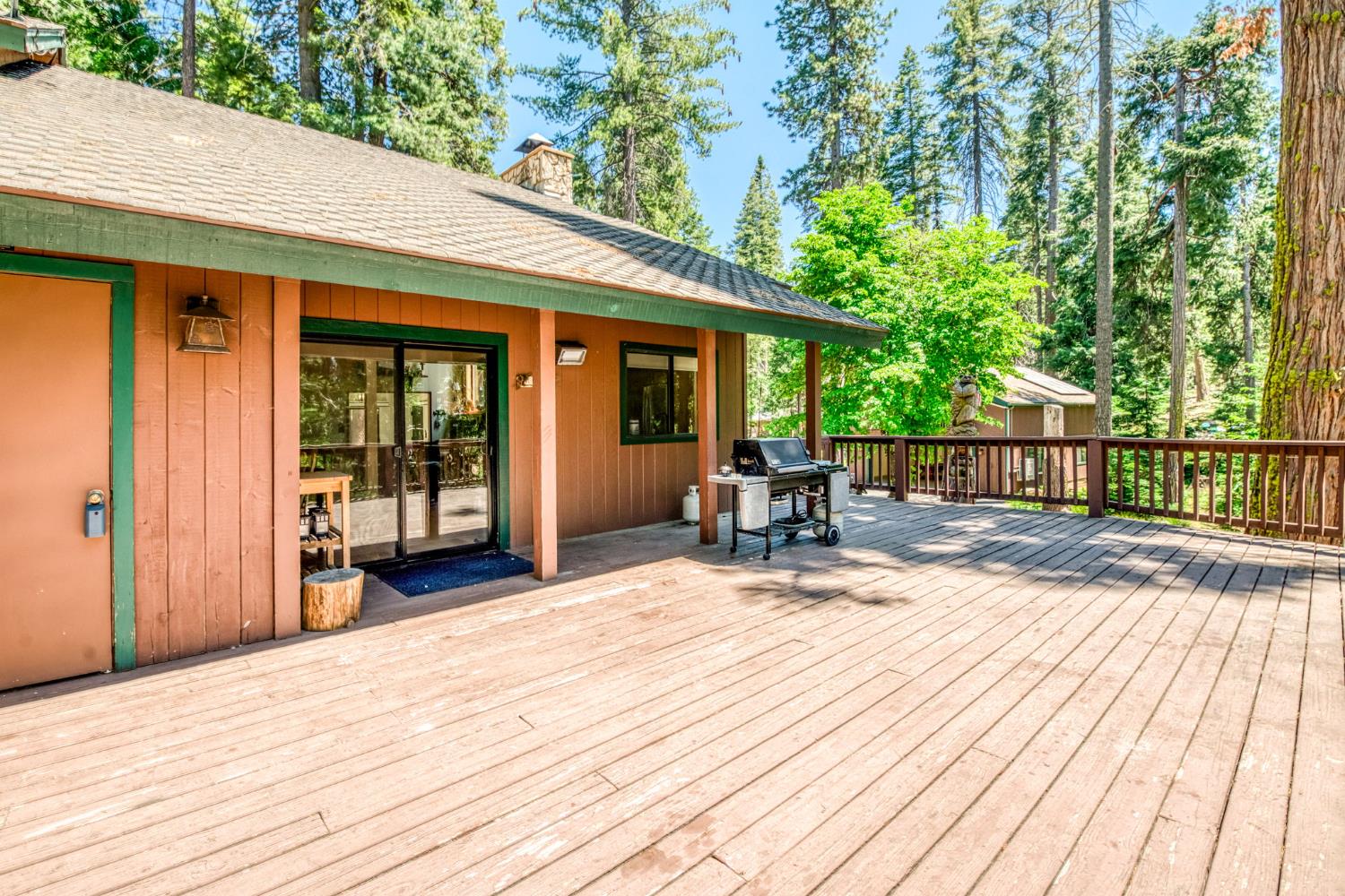 39145 Checkerbloom Lane Shaver Lake, CA 93664 - Photo 48 of 58 a view of backyard with a deck and wooden floor