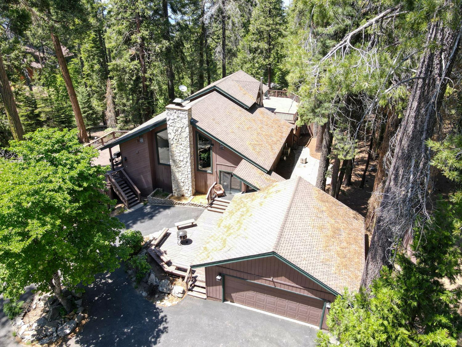 39145 Checkerbloom Lane Shaver Lake, CA 93664 - Photo 52 of 58 an aerial view of a house with swimming pool and sitting space