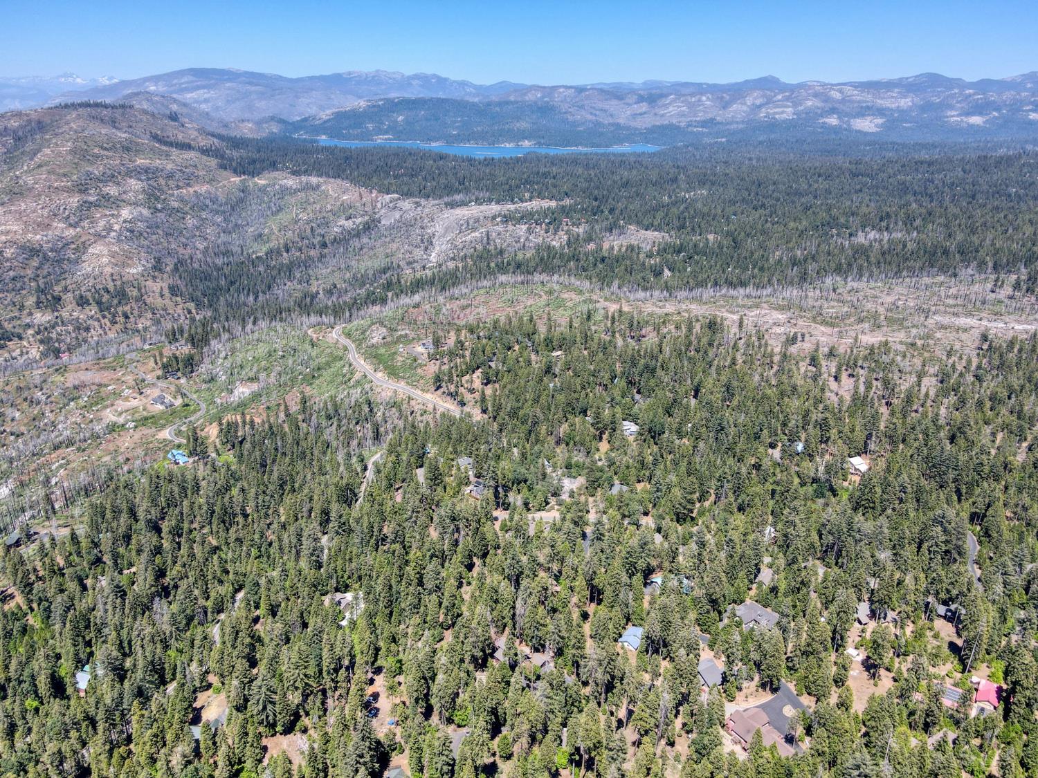 39145 Checkerbloom Lane Shaver Lake, CA 93664 - Photo 58 of 58 a view of a yard with a mountain