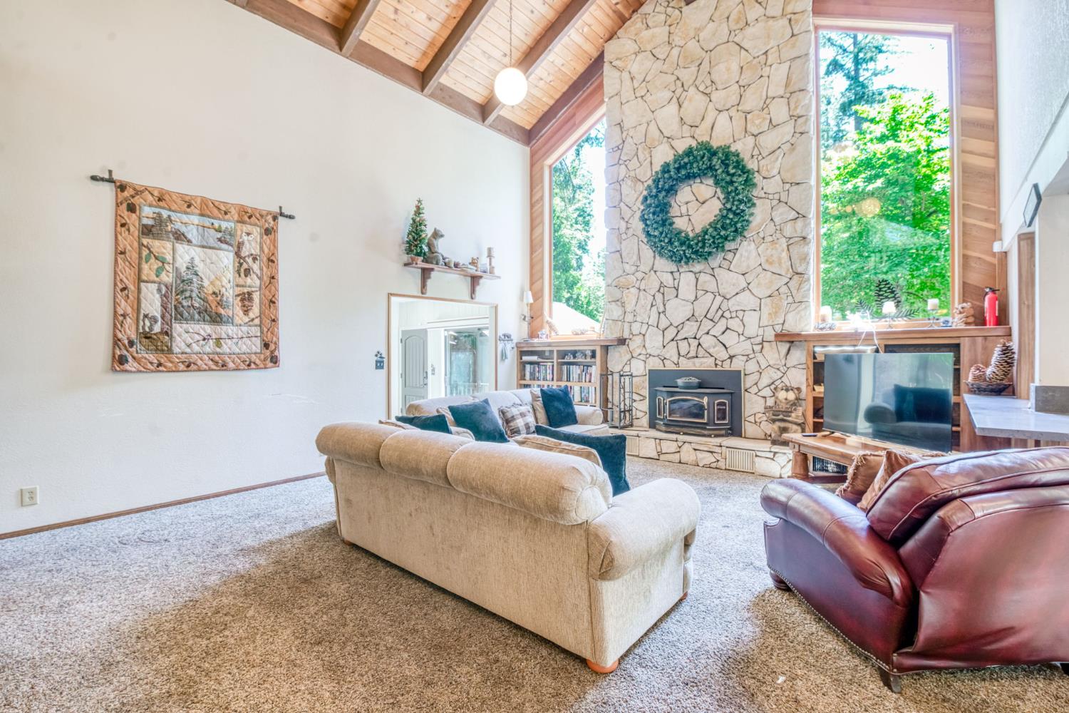39145 Checkerbloom Lane Shaver Lake, CA 93664 - Photo 6 of 58 a living room with furniture a fireplace and a large window